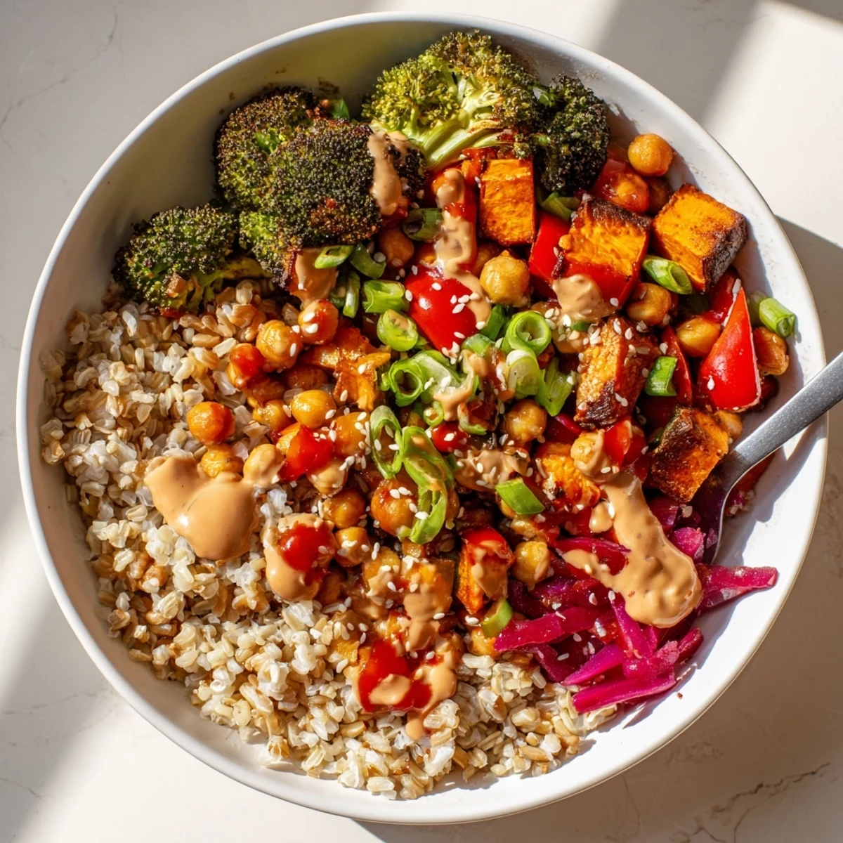 Colorful grain bowls showcasing bold sauce drizzles and fresh vegetables for a hearty meal.