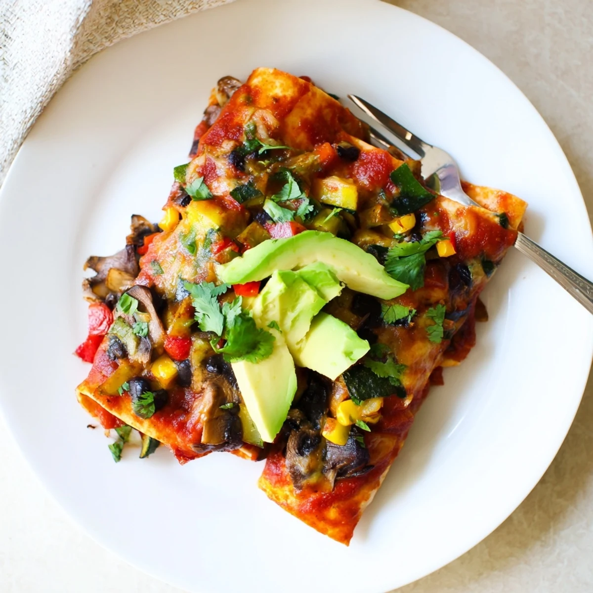 Comforting Farmers Market Vegetarian Enchiladas, filled with colorful veggies and flavorful sauce.  