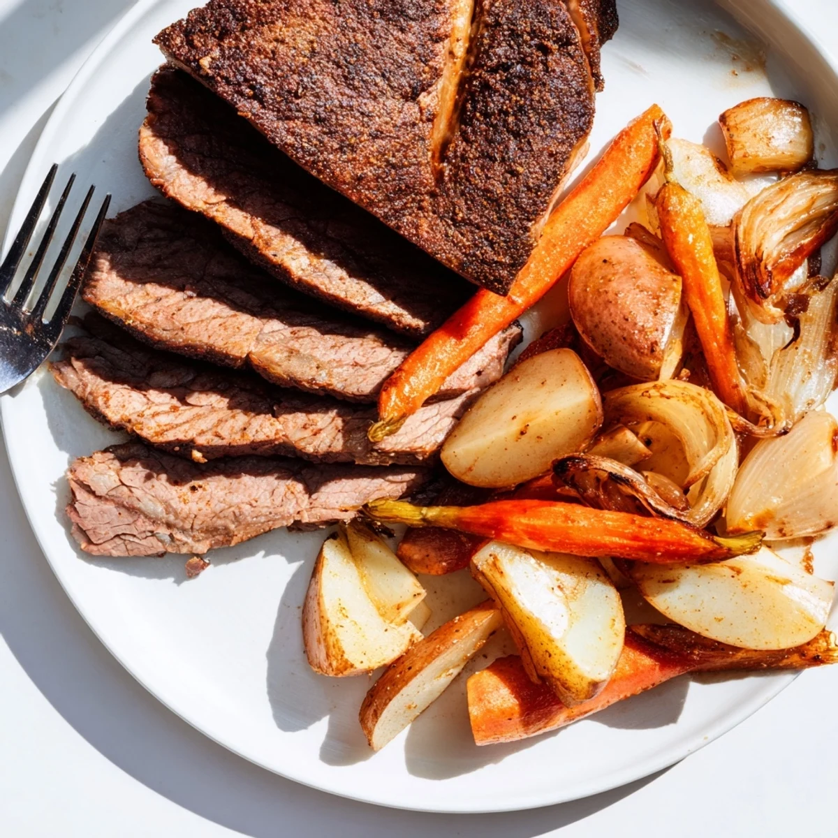 Tender Sunday Pot Roast with perfectly roasted vegetables, ready to serve for a comforting dinner.