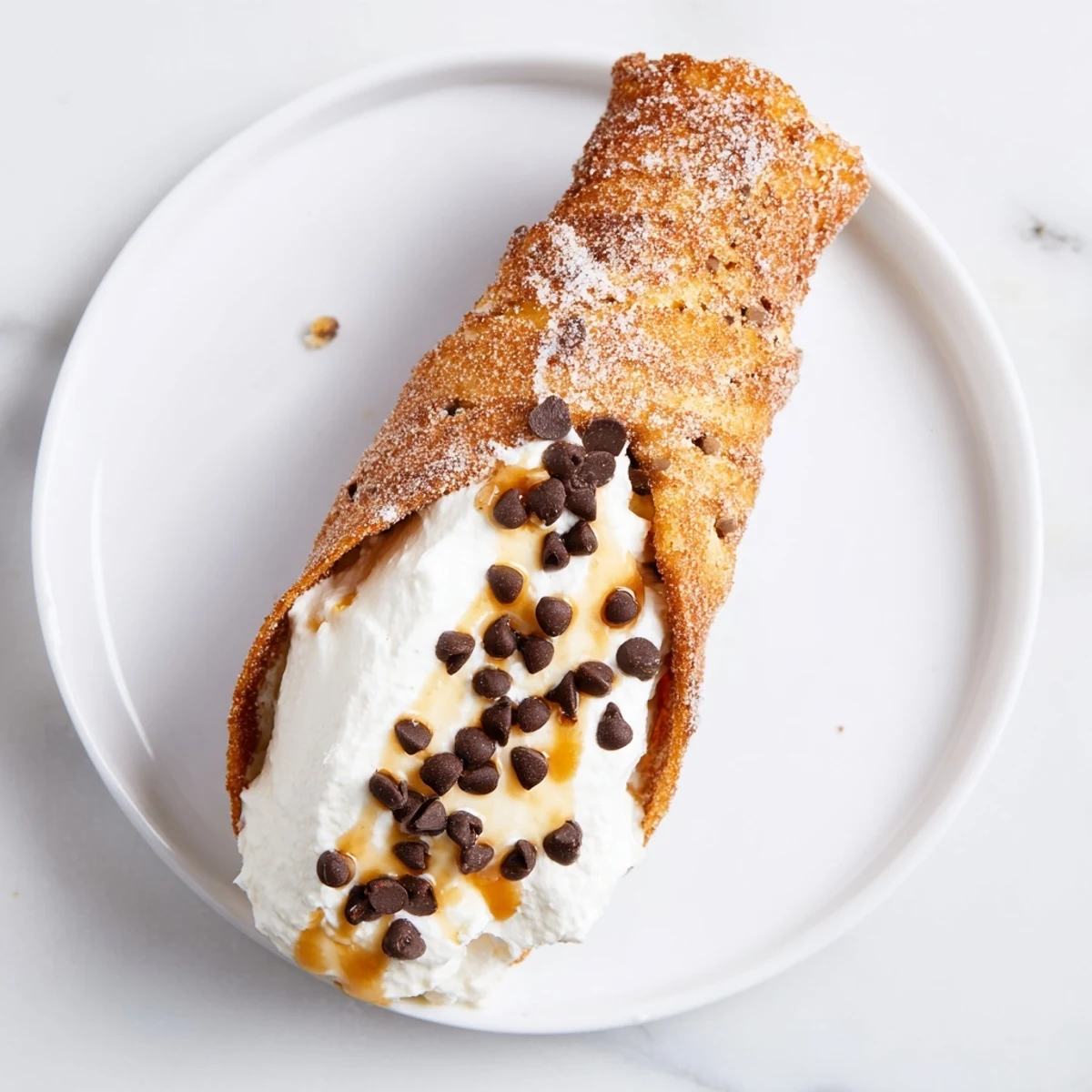 Golden, cinnamon-sugar Quick Churro Cheesecake Cones, filled with creamy cheesecake, ready to eat!