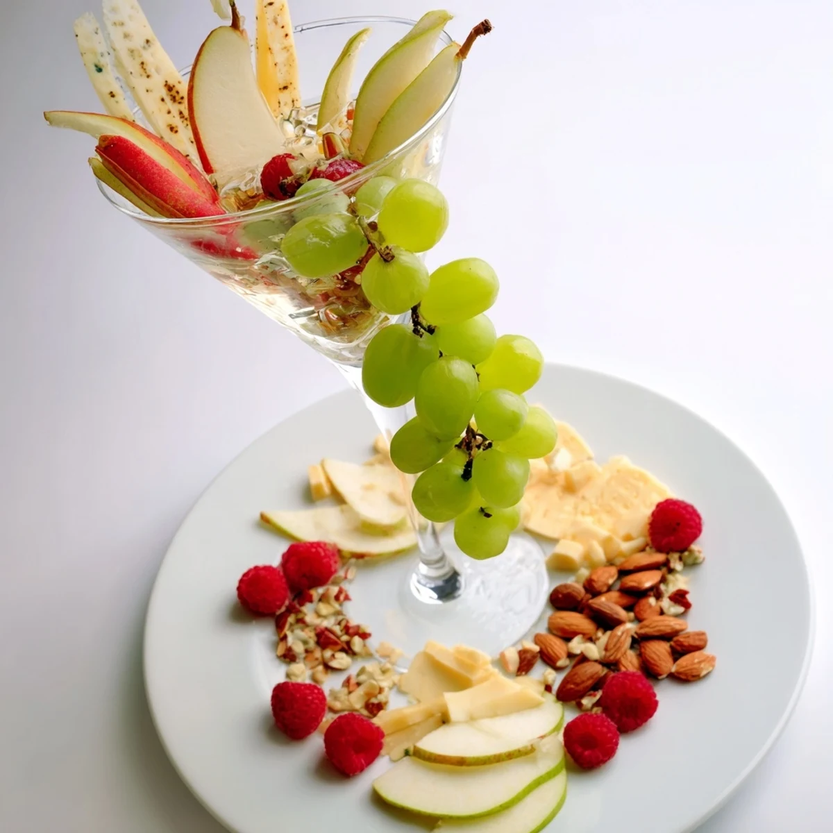 This vibrant Champagne Waterfall Board showcases a cascade of fruits and cheeses, perfect for any gathering.