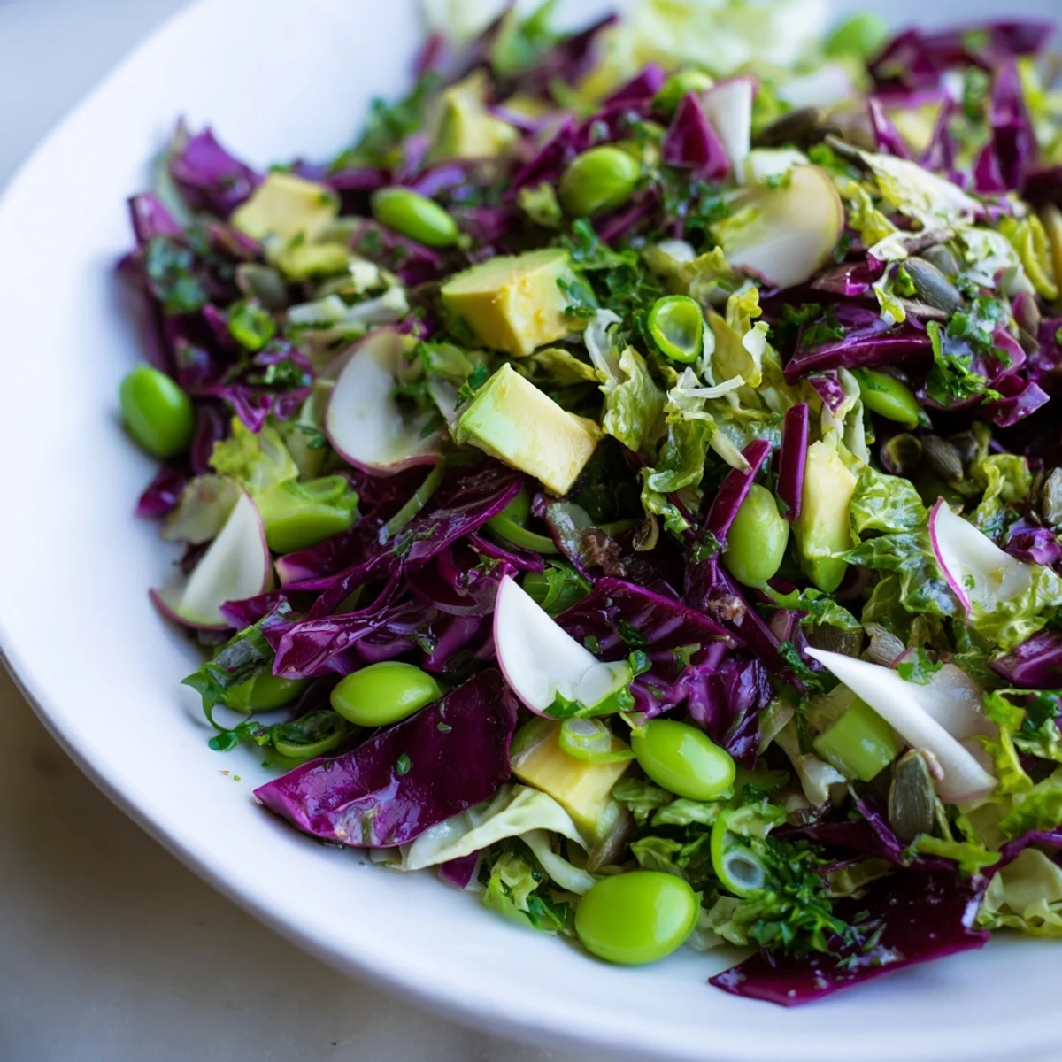 Vibrant Green Goddess Detox Cabbage Salad with crisp veggies and creamy avocado, ready to eat!