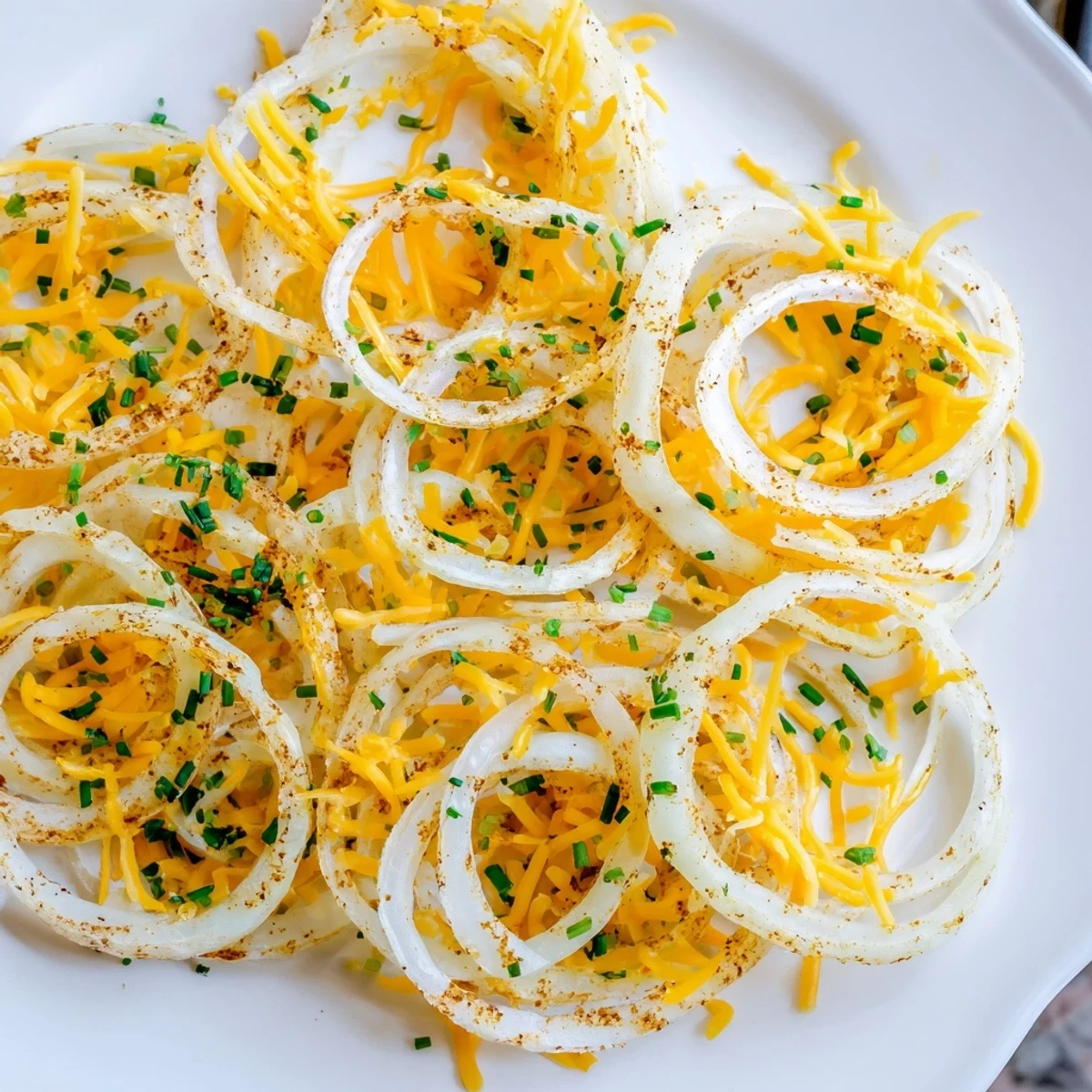 Golden, bubbly Crispy Onion Cheese Chips with melted cheese, perfect for a savory, low-carb snack!