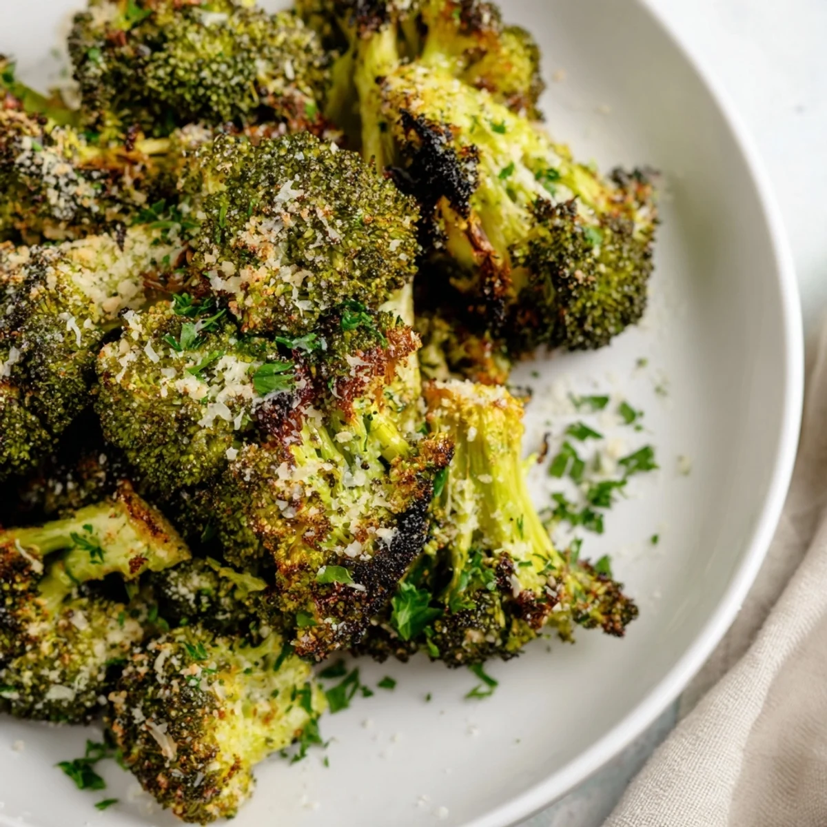 Golden, roasted Garlic Parmesan Broccoli, a flavorful side dish with crispy edges and melted cheese.