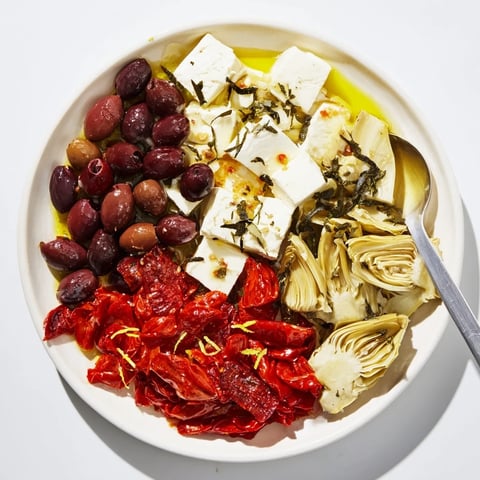 A beautifully arranged Black Olive and Sun-Dried Tomato platter, ready to be enjoyed with friends.