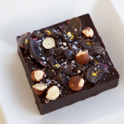 A close-up of The Midnight Mosaic: a decadent dessert with figs, olives, and chocolate.