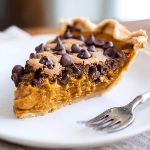 Decadent pumpkin chocolate chip cookie pie, baked in a buttery crust and topped with chocolate.  