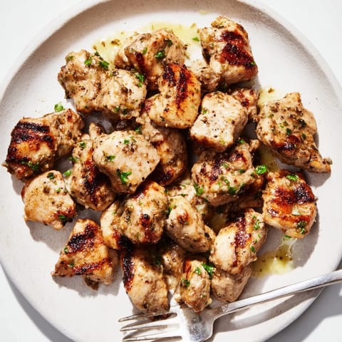 Tender grilled chicken bites served with rich, tangy creamy garlic dipping sauce.  
