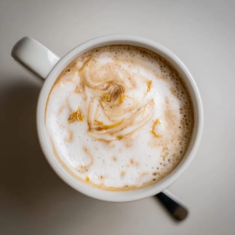 Discover the savory twist of Onion Latte, topped with frothy milk and a hint of sweetness.  