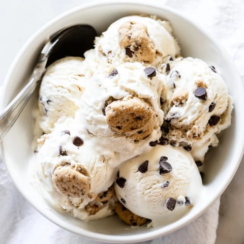 Indulge in Cottage Cheese Ice Cream with Cookie Dough, topped with sweet chocolate chips.  