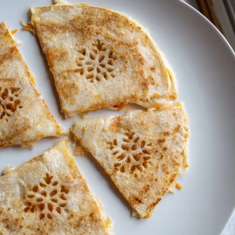 Imagine crispy, snowflake-shaped Express Quesadillas with melted cheese, ready to dip in salsa.