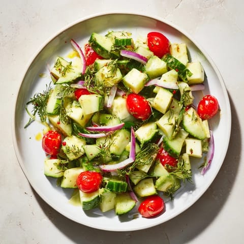 Simple Cucumber and Dill Chopped Salad: The vibrant colors of cucumbers, dill, and tomatoes mixed in a zesty dressing.