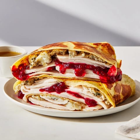 Melted cheese spills from this delicious Turkey, Stuffing & Cranberry Leftovers Tortilla Wrap, a satisfying meal.