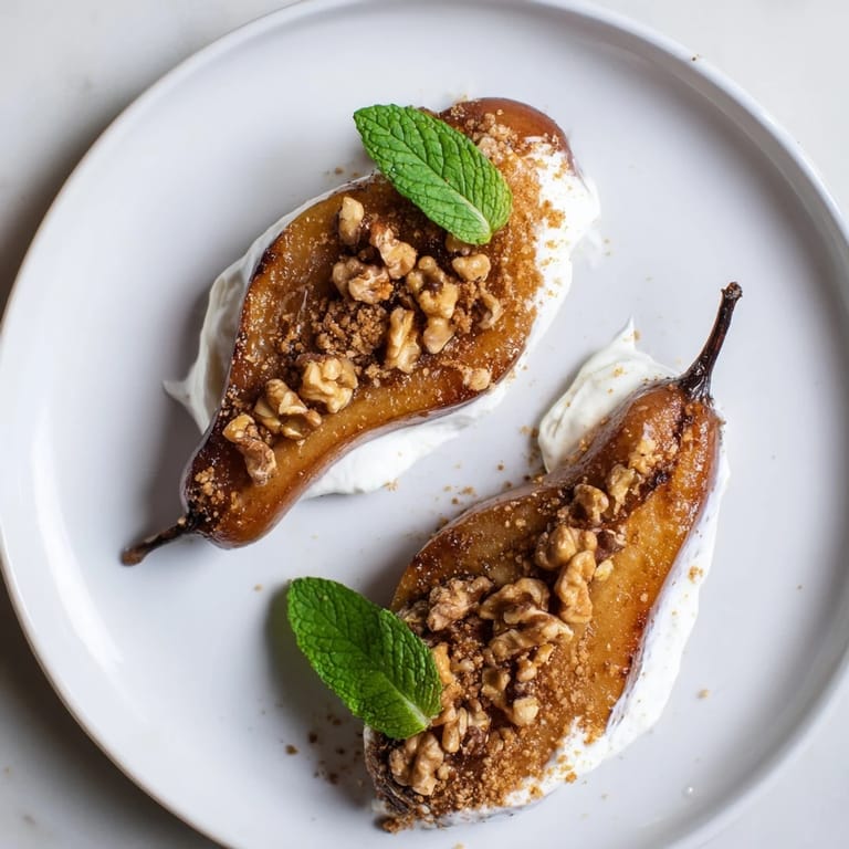 Golden roasted pears with cinnamon, generously topped with walnuts and creamy Greek yogurt.